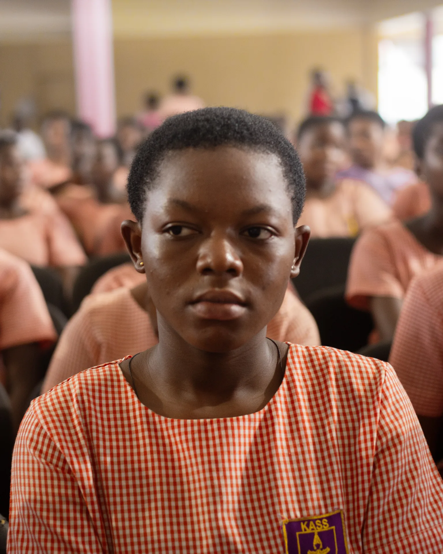 A schoolgirl listening during an outreach session