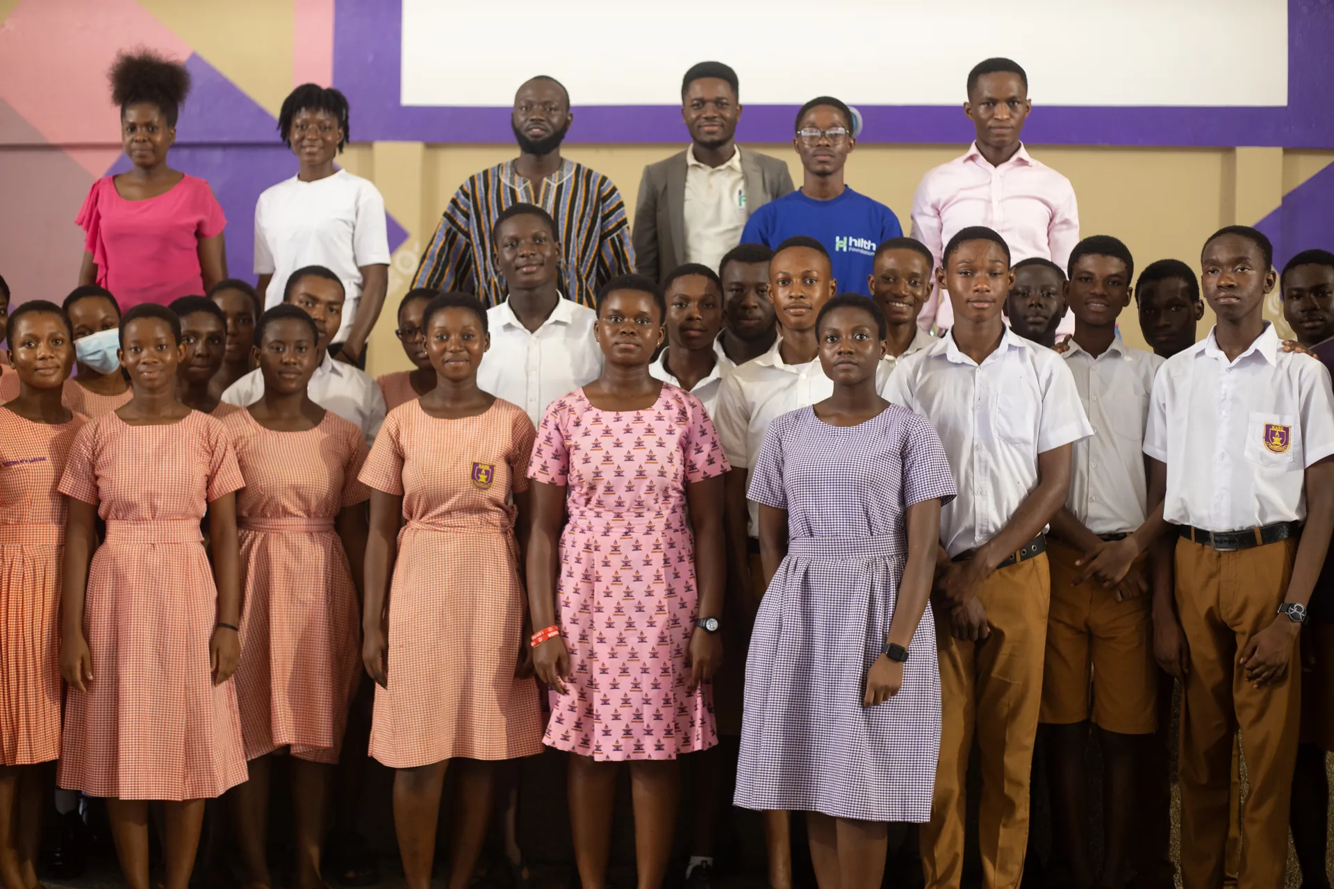 Hilth volunteers and students together after a school session