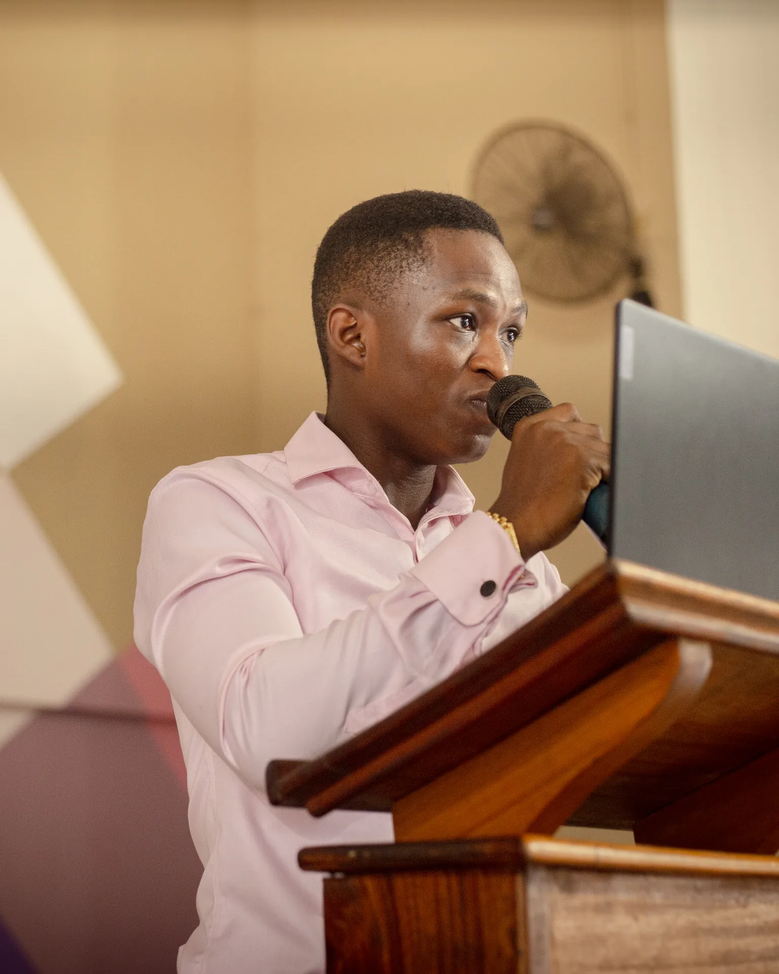 Speaker addressing a school outreach gathering